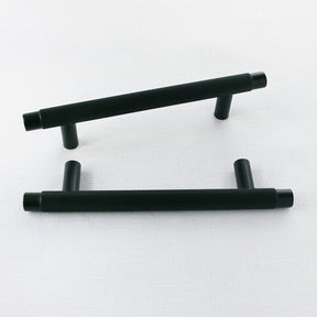 Matte black knurled kitchen cabinet pulls. Potter and Clay