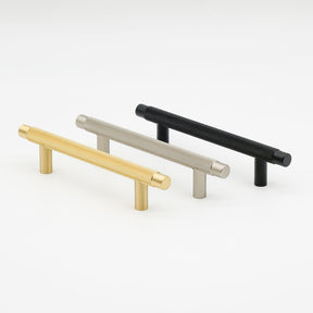 Knurled pulls in brushed brass, brushed nickel, and matte black. Potter and Clay